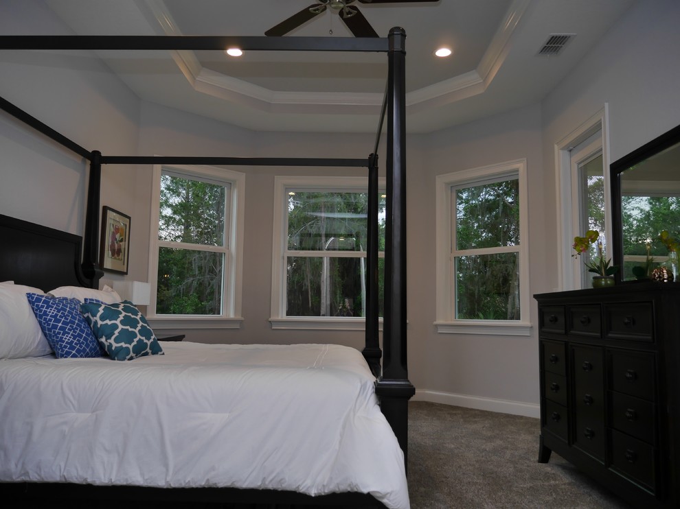 Inspiration for a mid-sized transitional master bedroom in Tampa with grey walls, carpet, no fireplace and grey floor.