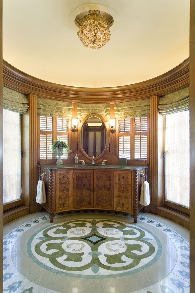 Inspiration for an expansive traditional master bathroom in Boston with furniture-like cabinets, medium wood cabinets, brown walls, marble floors, an undermount sink and multi-coloured floor.