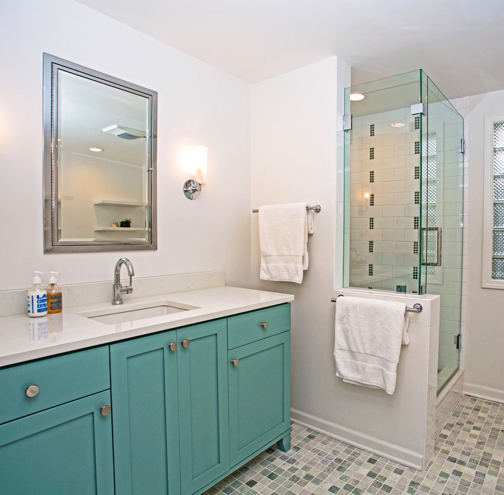 This is an example of a small transitional master bathroom in New York with shaker cabinets, green cabinets, a freestanding tub, an alcove shower, a two-piece toilet, white tile, subway tile, white walls, marble floors, an undermount sink, engineered quartz benchtops, green floor and a hinged shower door.