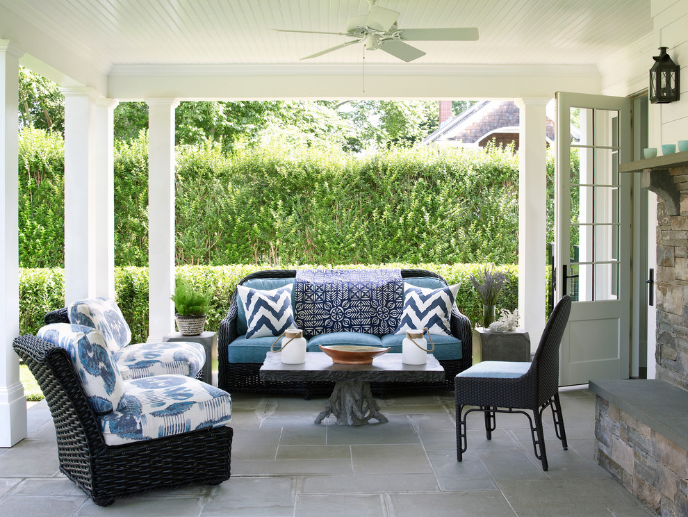 Inspiration for a mid-sized transitional patio in Jacksonville with a roof extension and with fireplace.