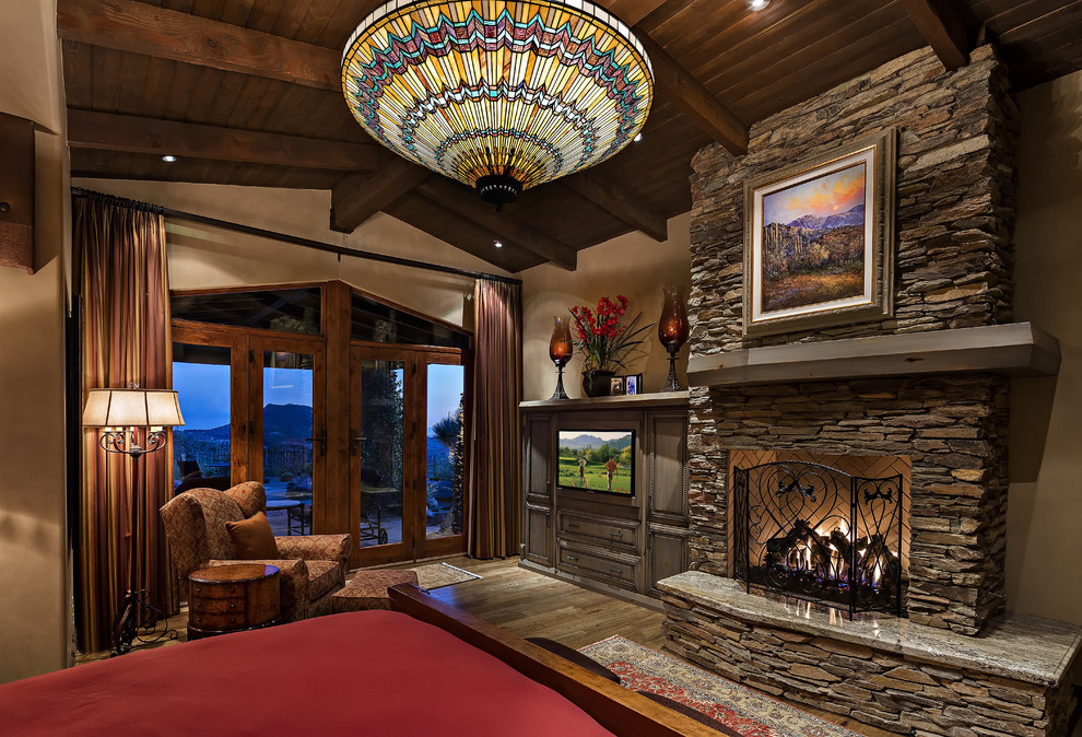 Example of a mountain style home design design in Phoenix