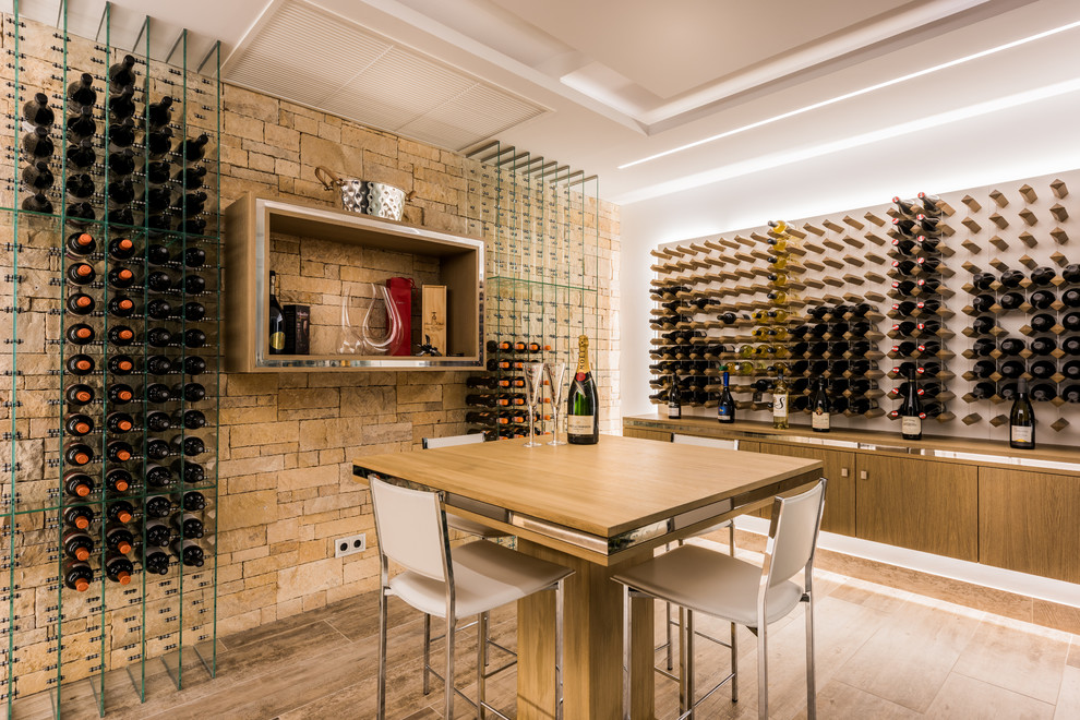 Contemporary wine cellar in Other with medium hardwood floors, storage racks and brown floor.