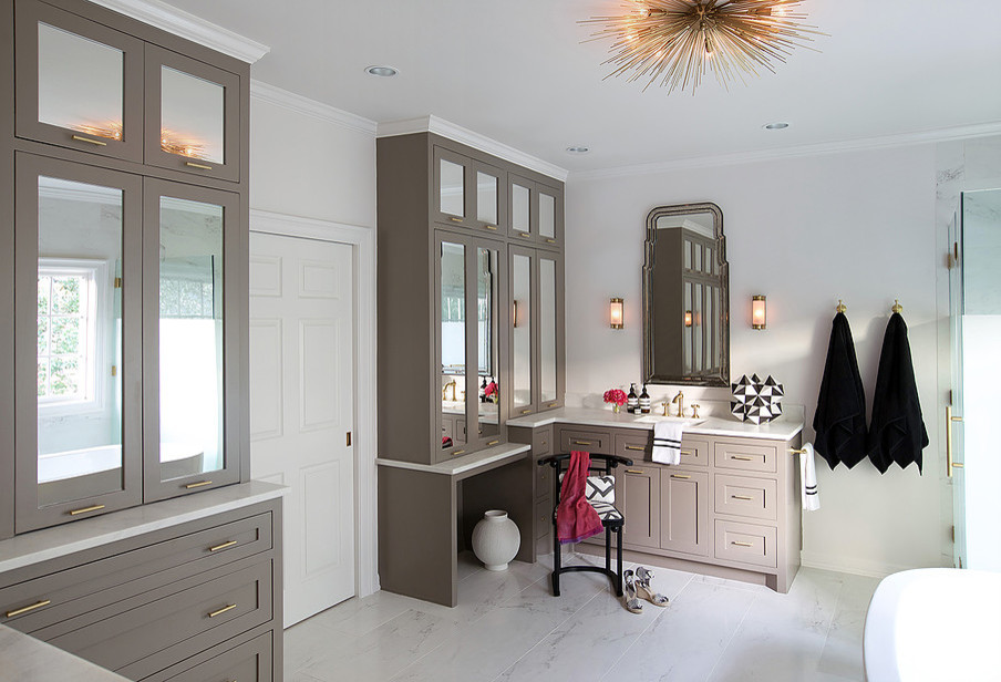 Inspiration for a mid-sized transitional master gray tile, white tile and stone tile marble floor freestanding bathtub remodel in Houston with shaker cabinets, beige cabinets, solid surface countertops, white walls and an integrated sink