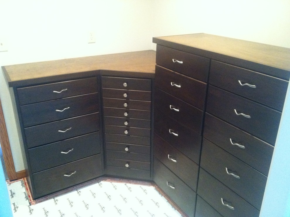 This is an example of a traditional storage and wardrobe in Wichita.