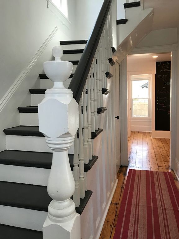 Inspiration for a mid-sized country wood straight staircase in New York with wood risers and wood railing.