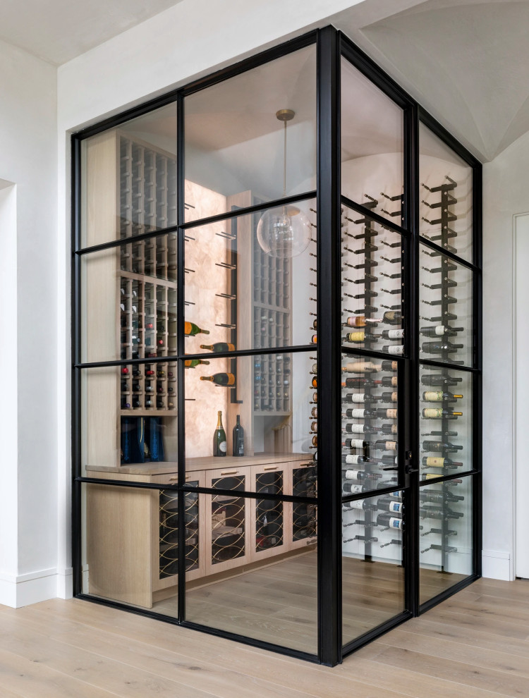 Photo of a contemporary wine cellar in Houston.