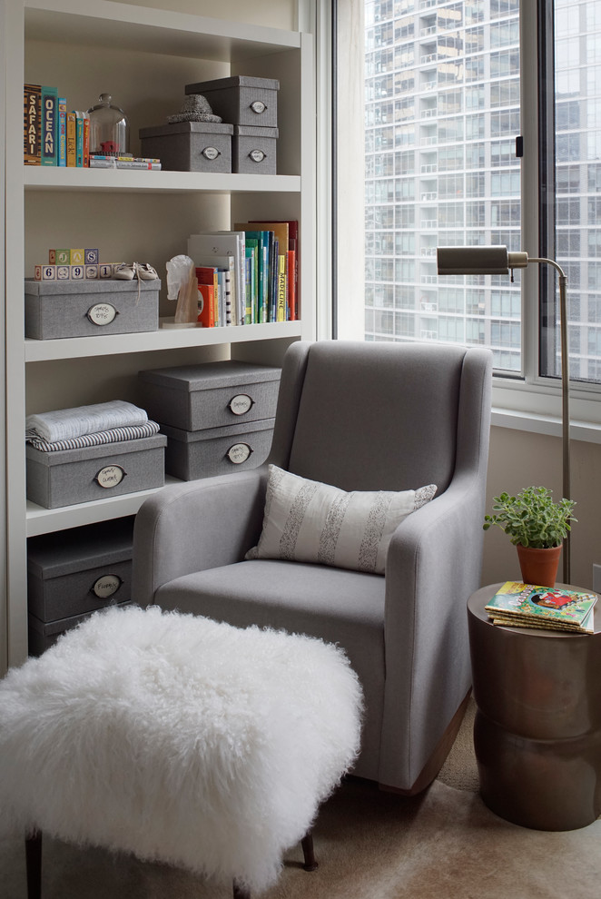 Inspiration for a mid-sized contemporary nursery in Chicago with beige walls and brown floor.