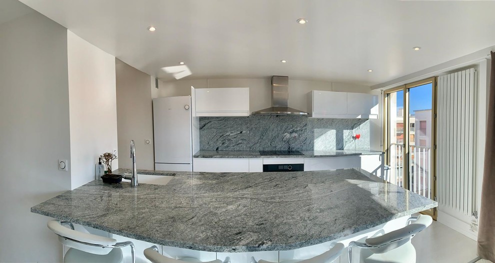 Design ideas for a large mediterranean galley eat-in kitchen in Paris with an integrated sink, granite benchtops, grey splashback, with island and grey benchtop.