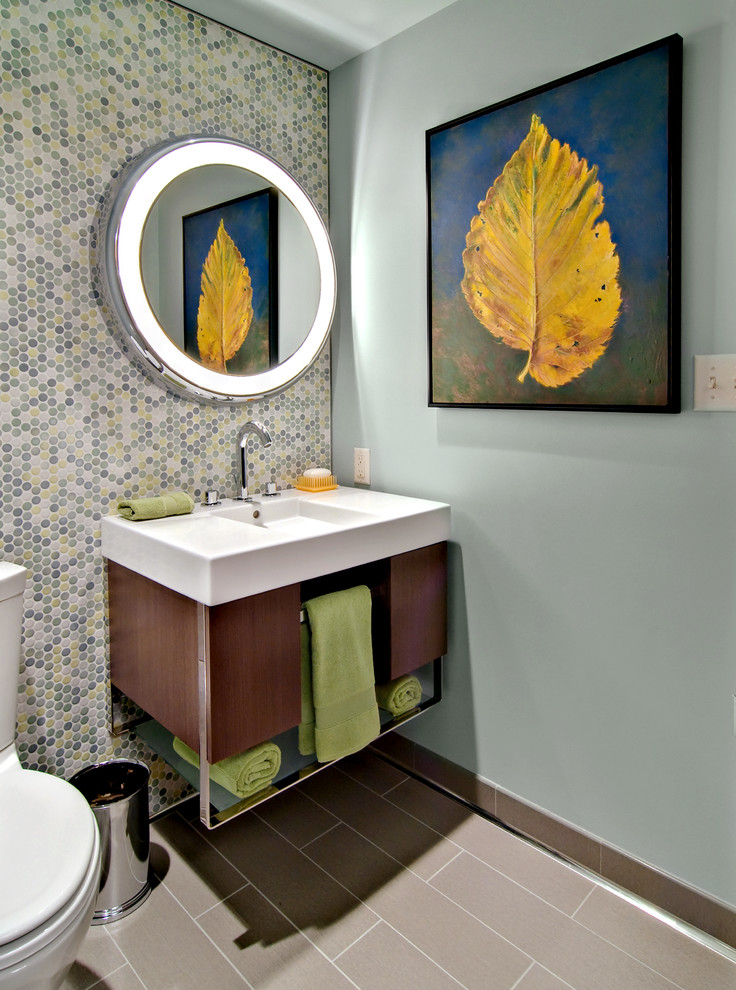 Midcentury powder room in Minneapolis with an integrated sink, open cabinets, multi-coloured tile, mosaic tile and a two-piece toilet.