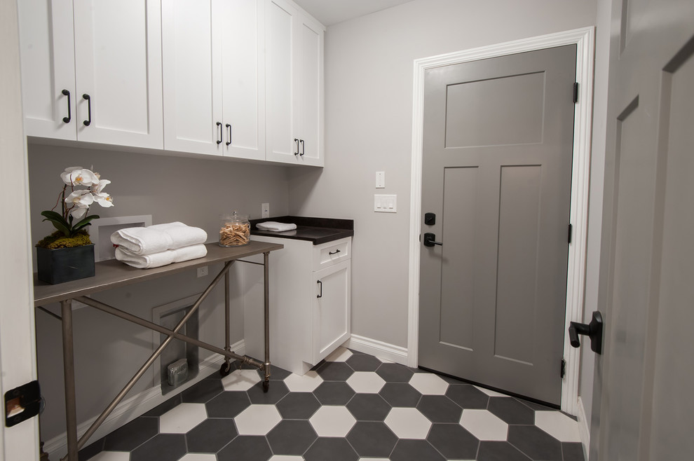 This is an example of a transitional laundry room in Los Angeles.