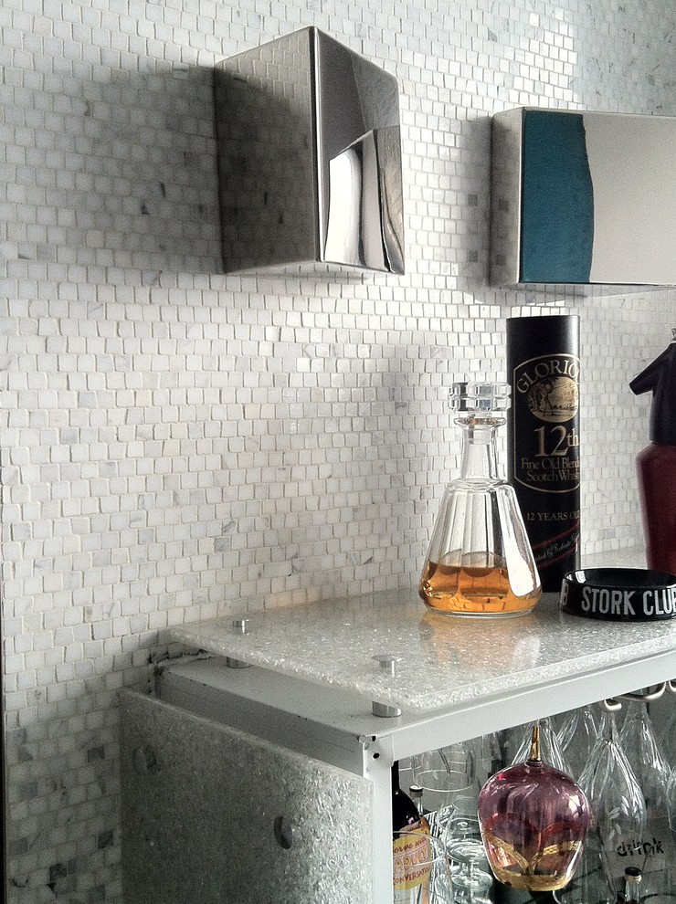 This is an example of a small modern single-wall bar cart in New York with recycled glass benchtops, white splashback and marble splashback.