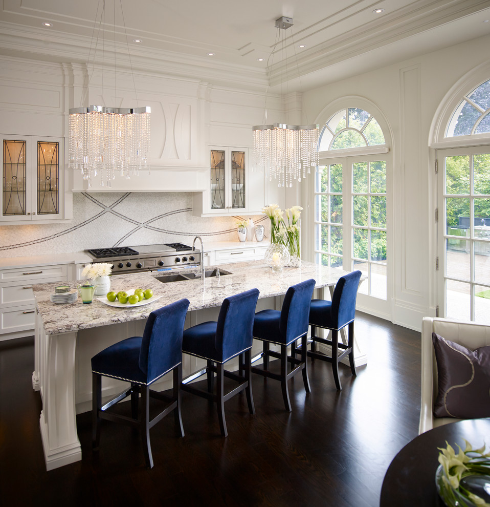 Example of a large transitional single-wall dark wood floor eat-in kitchen design in Toronto with marble countertops, mosaic tile backsplash, paneled appliances, an island, a double-bowl sink, shaker cabinets and white backsplash