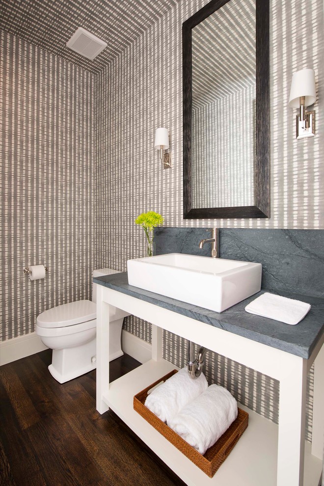 Inspiration for a transitional powder room in Dallas with brown floor.