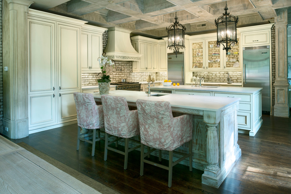 Example of a large transitional l-shaped open concept kitchen design in Atlanta with beaded inset cabinets and two islands