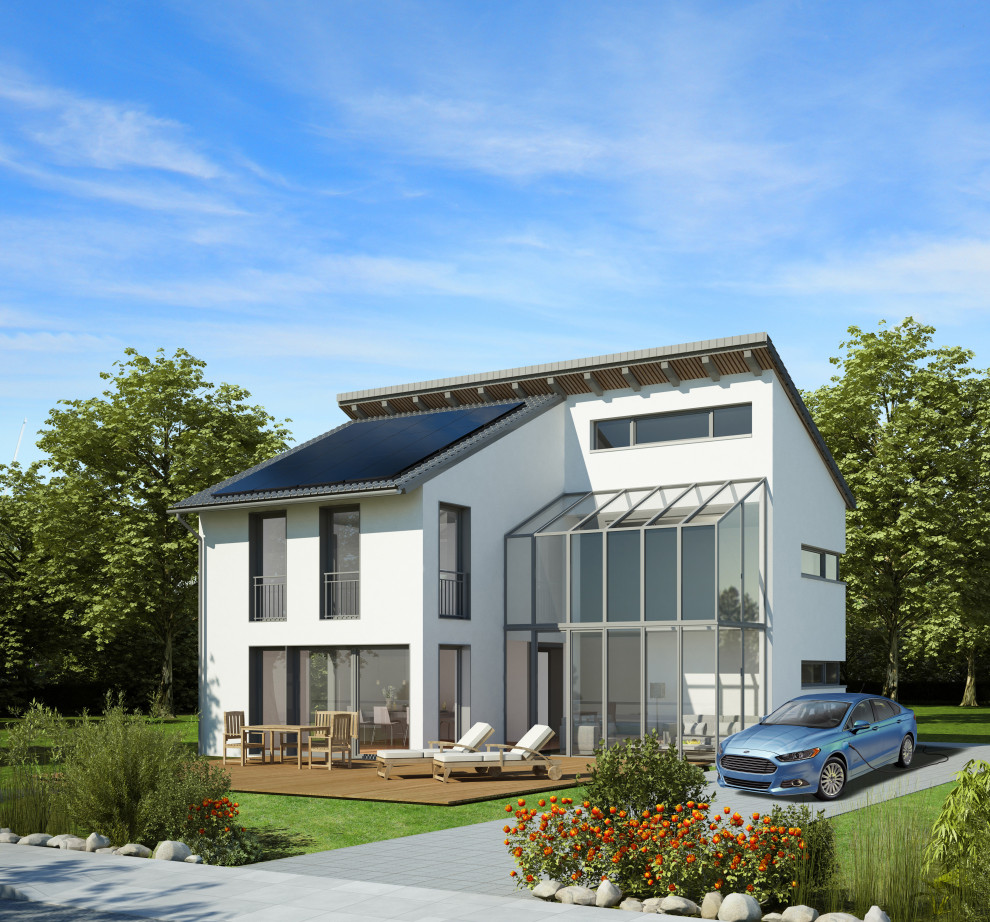 Идея дизайна: двухэтажный, белый частный загородный дом в стиле модернизм с облицовкой из цементной штукатурки, черепичной крышей и серой крышей