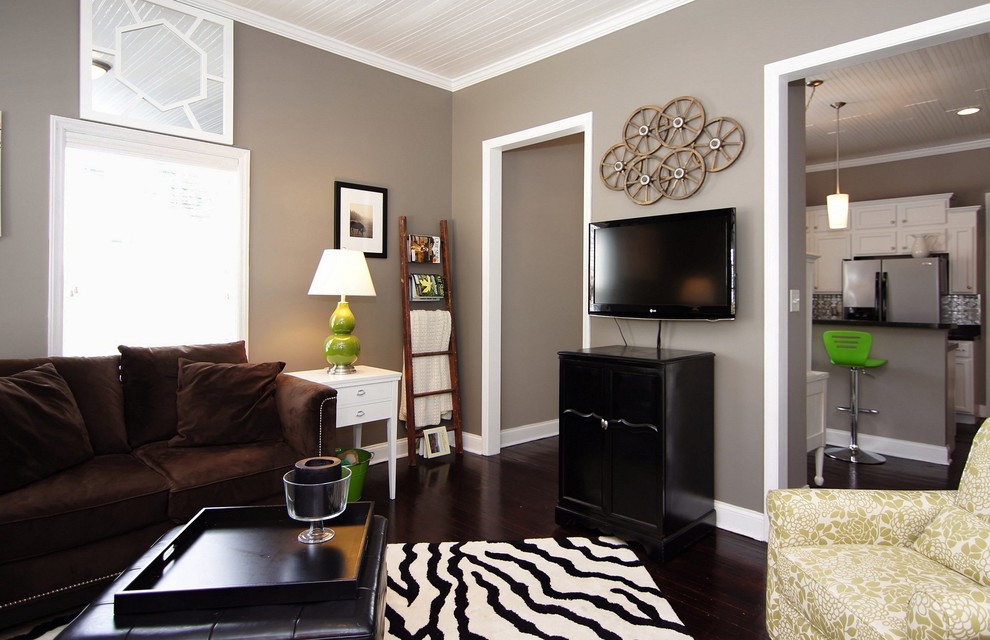 Photo of a small contemporary enclosed living room in Raleigh with a home bar, grey walls, dark hardwood floors, timber and a wall-mounted tv.