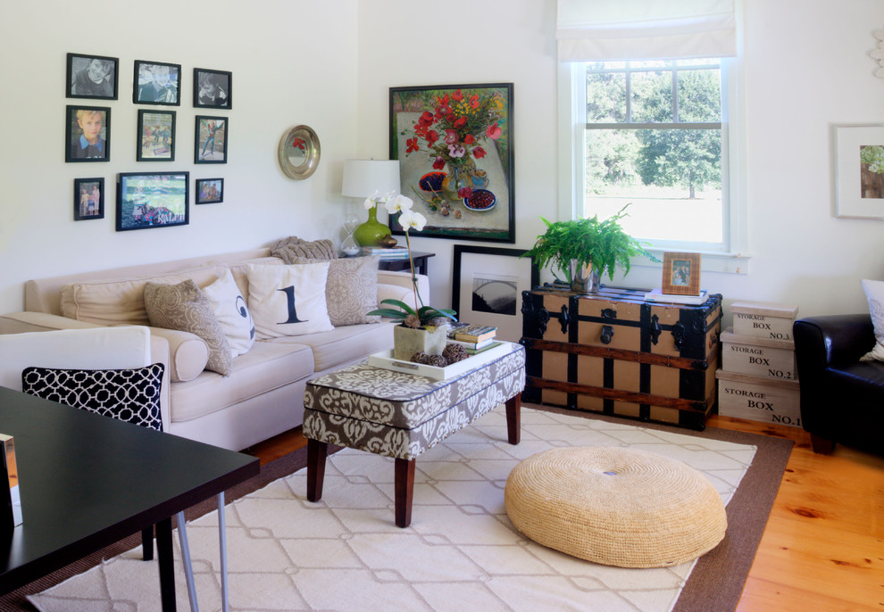 Design ideas for a mid-sized country living room in Raleigh with white walls.