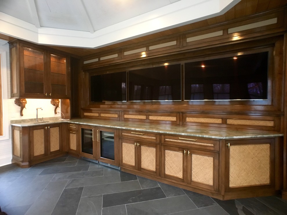 Design ideas for a mid-sized traditional l-shaped wet bar in Milwaukee with an undermount sink, flat-panel cabinets, medium wood cabinets, quartz benchtops, multi-coloured splashback, timber splashback and slate floors.