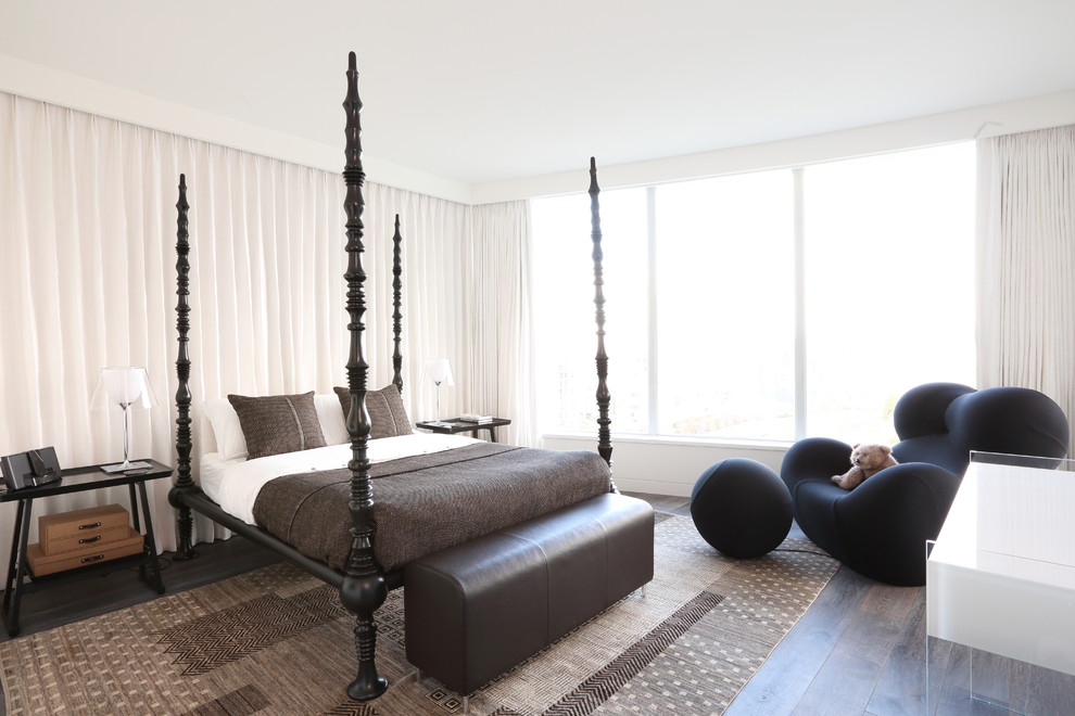 Bedroom - mid-sized contemporary master medium tone wood floor and brown floor bedroom idea in Vancouver with white walls