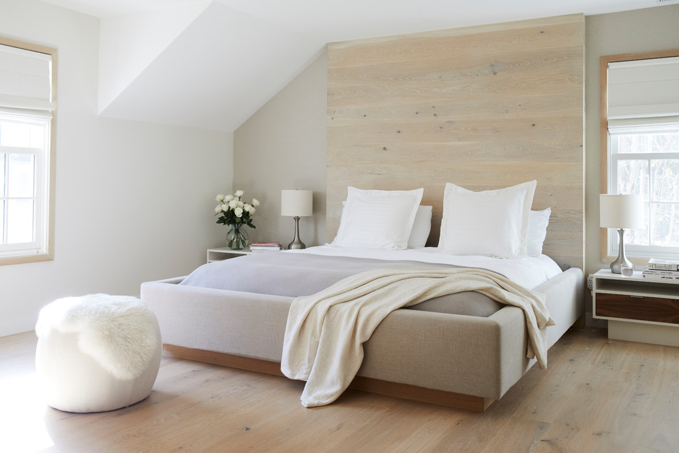 Photo of a contemporary master bedroom in San Francisco with beige walls, light hardwood floors and beige floor.