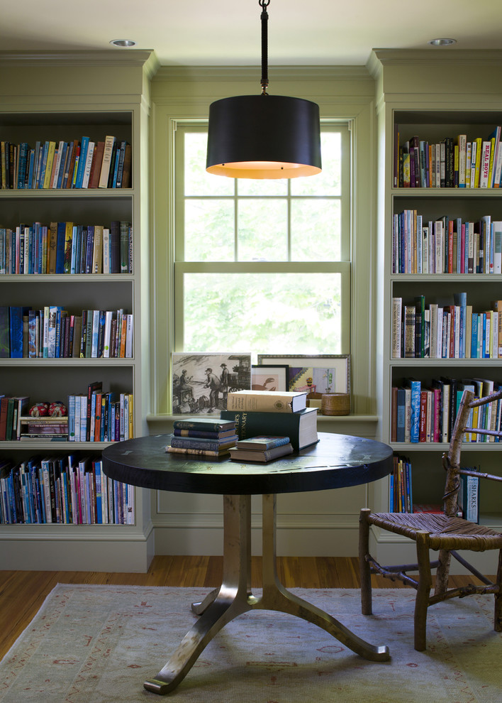 Design ideas for a beach style family room in Boston with a library.