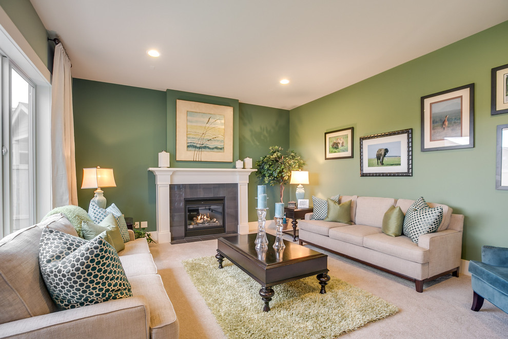 Photo of a transitional open concept family room in Seattle with a game room, green walls, carpet, a standard fireplace, a tile fireplace surround and no tv.