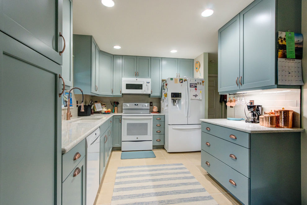 This is an example of a small eclectic u-shaped separate kitchen in Other with an undermount sink, shaker cabinets, turquoise cabinets, quartz benchtops, beige splashback, white appliances and turquoise benchtop.
