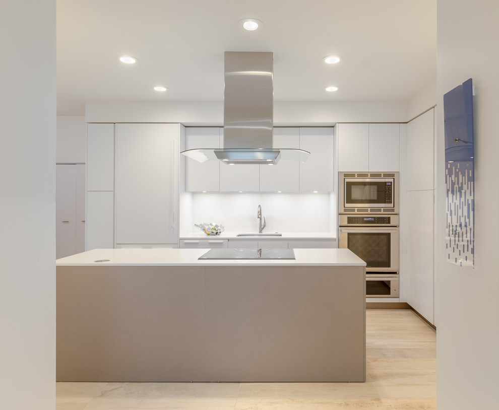 Inspiration for a small contemporary u-shaped kitchen in Other with an undermount sink, white cabinets, quartz benchtops, white splashback, stainless steel appliances and with island.