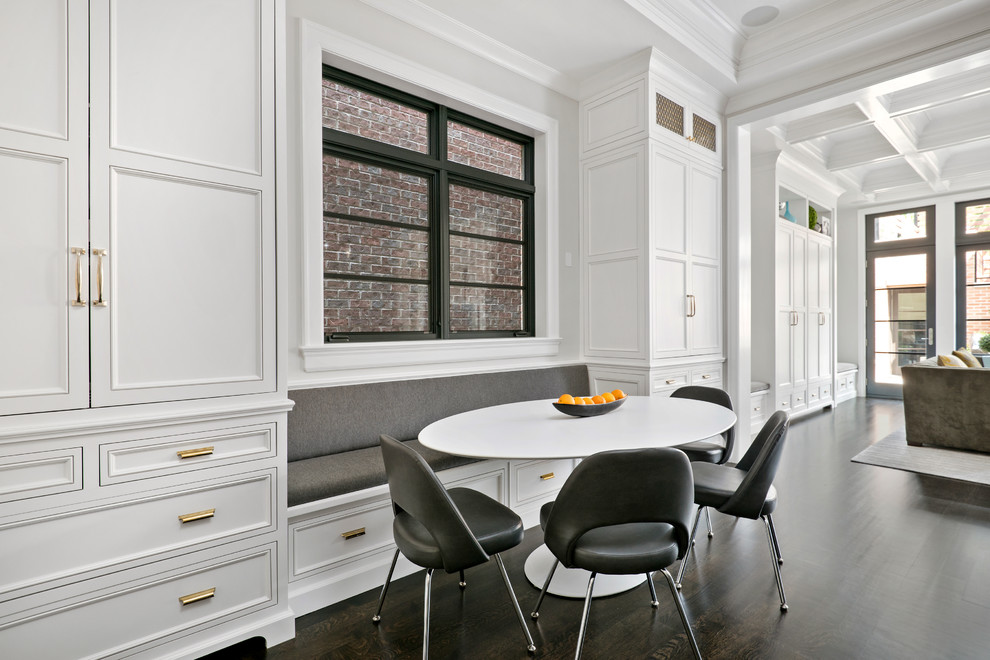 Open concept kitchen - huge transitional u-shaped dark wood floor open concept kitchen idea in Chicago with recessed-panel cabinets, white cabinets, quartzite countertops, paneled appliances and an island