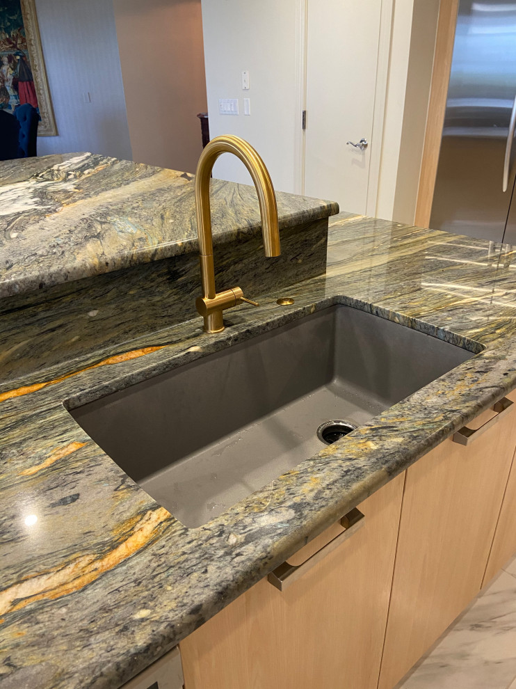 Inspiration for a transitional kitchen remodel in Tampa with quartzite countertops and an island
