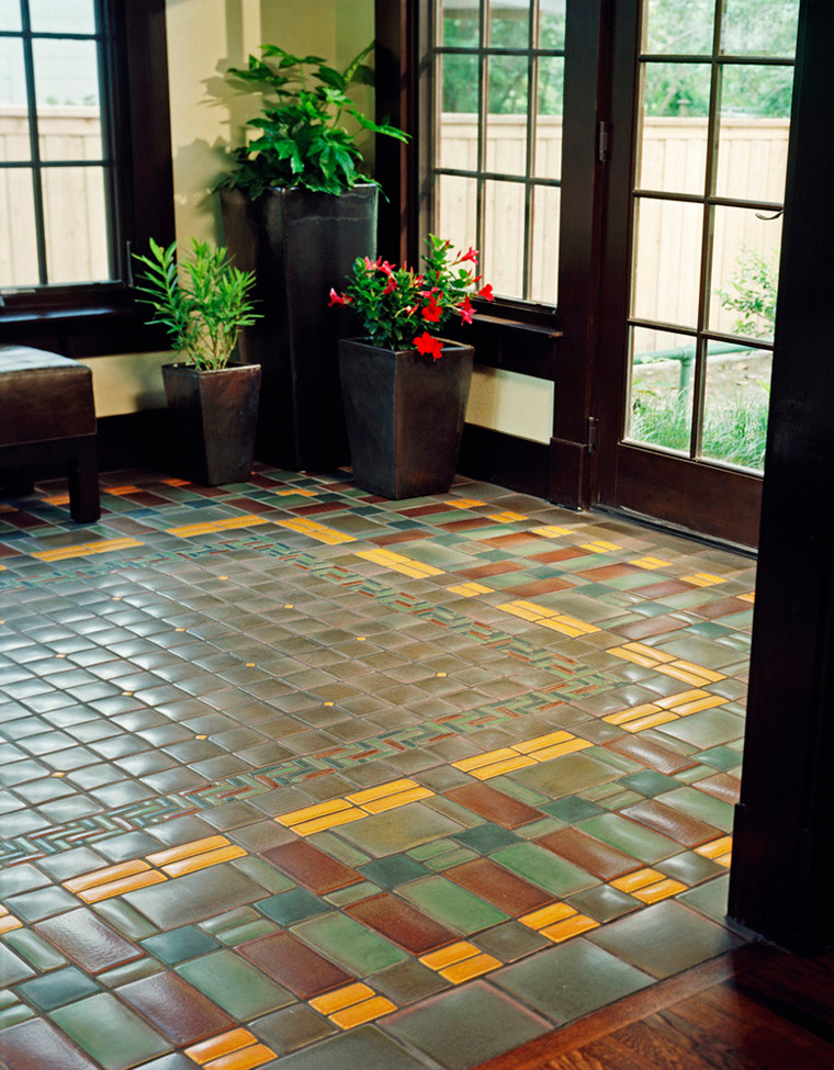 Inspiration for an arts and crafts foyer in Detroit with ceramic floors and green floor.