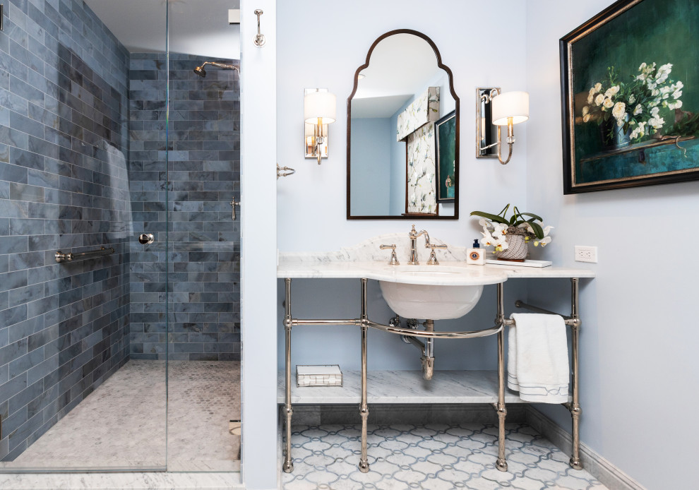 Photo of a mid-sized traditional 3/4 bathroom in Seattle with an alcove shower, a bidet, blue tile, marble, blue walls, marble floors, an undermount sink, marble benchtops, blue floor, white benchtops, a single vanity and a freestanding vanity.