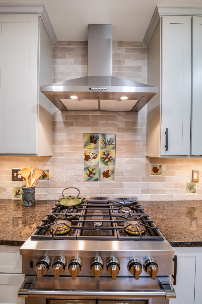 Kitchen - rustic kitchen idea in Charlotte with a farmhouse sink, shaker cabinets, white cabinets, beige backsplash, subway tile backsplash, stainless steel appliances and brown countertops