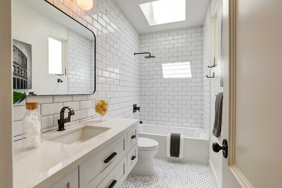 Inspiration for a transitional kids bathroom in Other with recessed-panel cabinets, white cabinets, an alcove tub, a shower/bathtub combo, subway tile, white walls, mosaic tile floors, an undermount sink, white floor, beige benchtops, beige tile, engineered quartz benchtops, a shower curtain and a floating vanity.