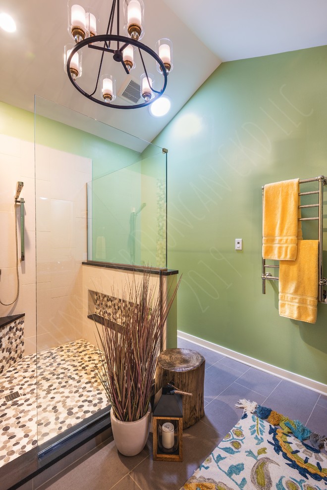 This is an example of a mid-sized arts and crafts master bathroom in Richmond with recessed-panel cabinets, dark wood cabinets, an open shower, a two-piece toilet, beige tile, porcelain tile, green walls, porcelain floors, an undermount sink, wood benchtops, grey floor, a hinged shower door and black benchtops.