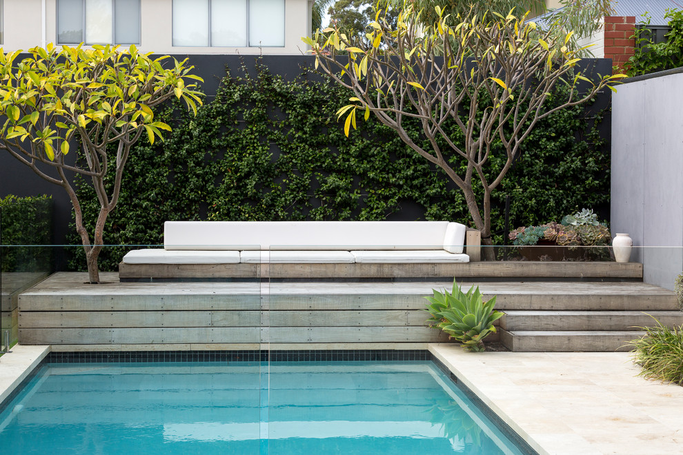 Pool - mid-sized backyard concrete paver and rectangular pool idea in Perth