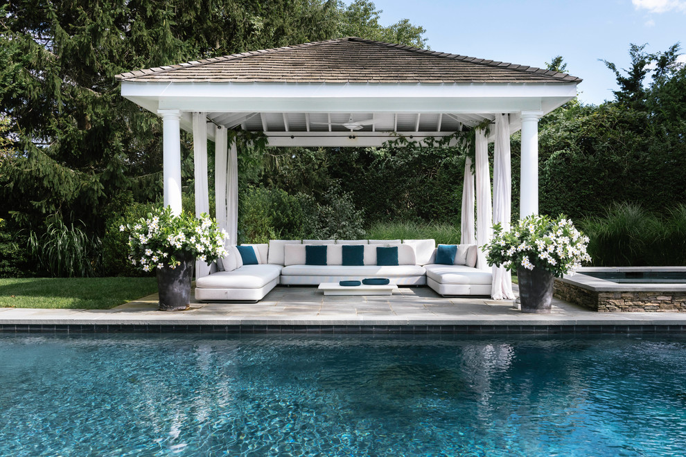 Photo of a traditional backyard patio in New York with a gazebo/cabana.