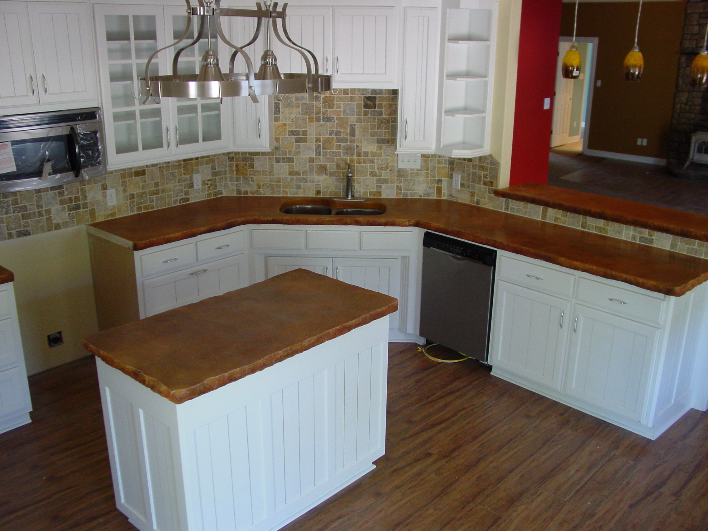 Kitchen with Concrete Countertops with Rock Edge