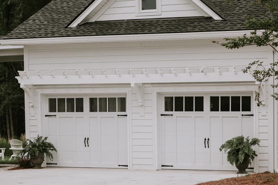 Photo of a mid-sized traditional attached two-car garage in St Louis.