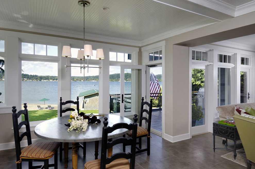 Photo of a transitional dining room in Seattle with beige walls.