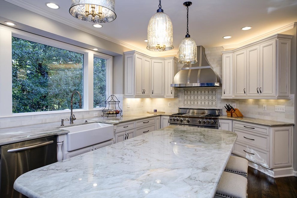 Eat-in kitchen - transitional u-shaped dark wood floor eat-in kitchen idea in Cedar Rapids with a farmhouse sink, flat-panel cabinets, white cabinets, marble countertops, stainless steel appliances and an island