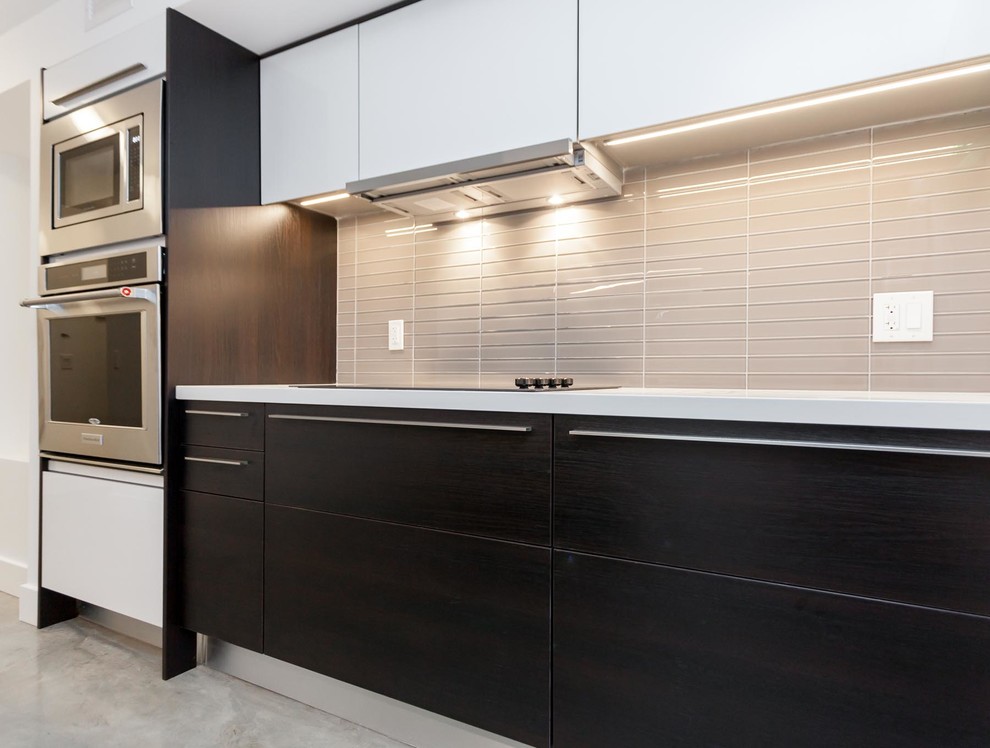 Photo of a small contemporary eat-in kitchen in Toronto with white cabinets.
