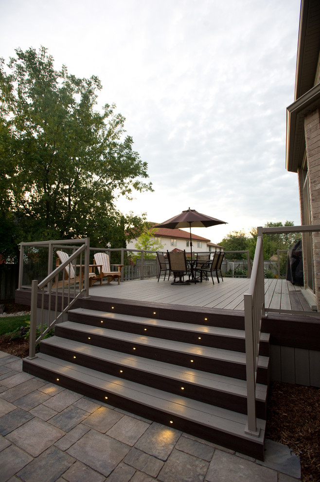 Design ideas for a large contemporary backyard deck in Toronto with an outdoor kitchen and no cover.