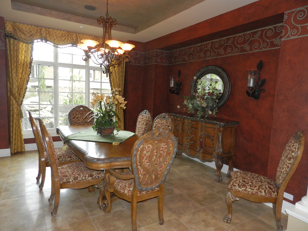 Example of a mid-sized classic travertine floor enclosed dining room design in Seattle with red walls and no fireplace