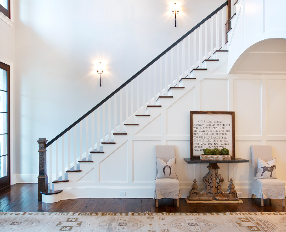 Photo of a mid-sized country foyer in Nashville with white walls and dark hardwood floors.