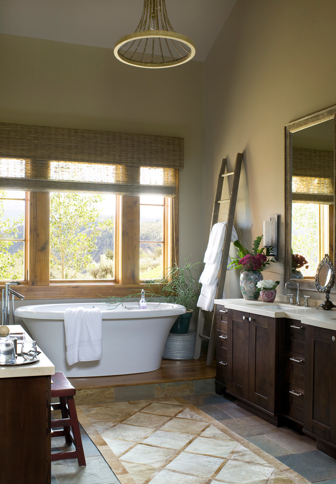 Inspiration for a country bathroom in Denver with a freestanding tub.