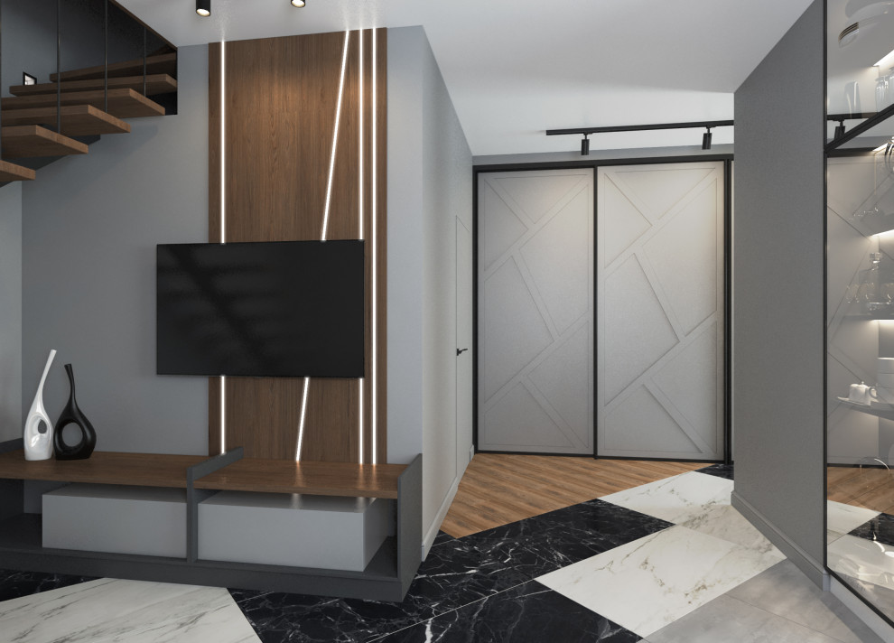 Inspiration för ett mellanstort funkis vardagsrum, med grå väggar, klinkergolv i porslin och en väggmonterad TV