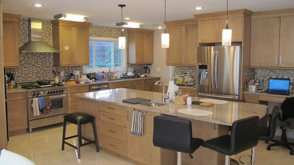 Inspiration for a mid-sized transitional u-shaped concrete floor and beige floor open concept kitchen remodel in New York with an undermount sink, an island, recessed-panel cabinets, light wood cabinets, granite countertops, multicolored backsplash, mosaic tile backsplash, stainless steel appliances and beige countertops