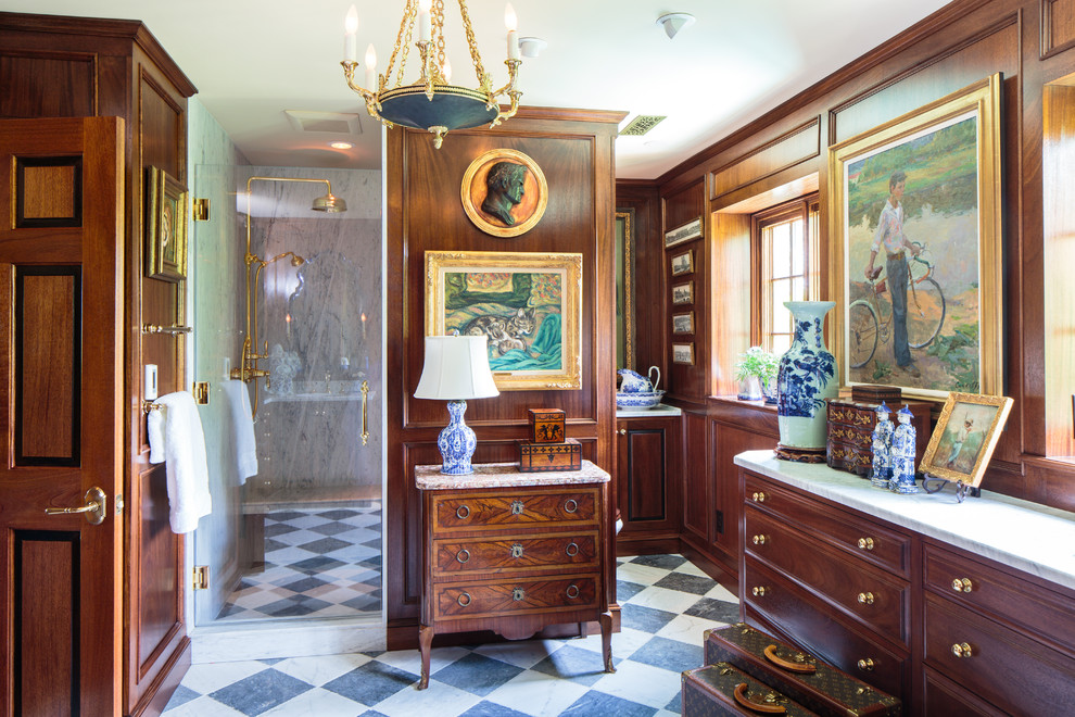 Inspiration for an expansive mediterranean master bathroom in Nashville with furniture-like cabinets, medium wood cabinets, marble benchtops, an alcove shower, white tile, stone slab, brown walls and ceramic floors.