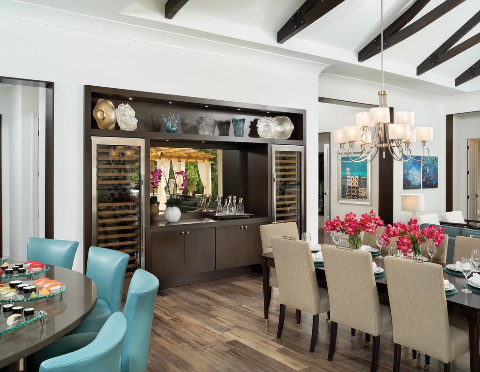 Design ideas for a mid-sized transitional open plan dining in Orlando with white walls, dark hardwood floors and no fireplace.